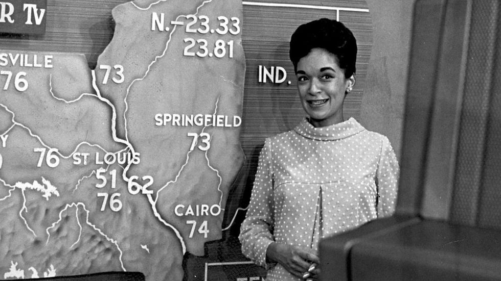 June Bacon-Bercey forecasting the weather.