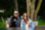 A couple and their dog enjoying the dog-friendly outdoor bar at The Sagamore.
