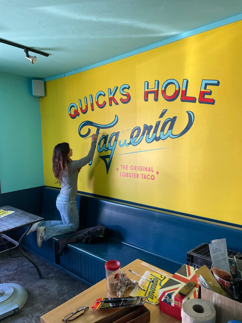 Quicks Hole Taquería mural being painted by Chipie Design.