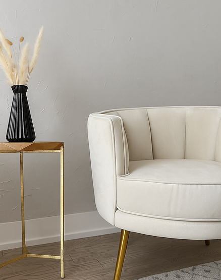 Textured accent wall behind an accent chair and side table