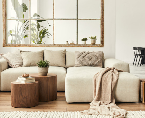 Spacious living room showcasing minimalist design with neutral tones.