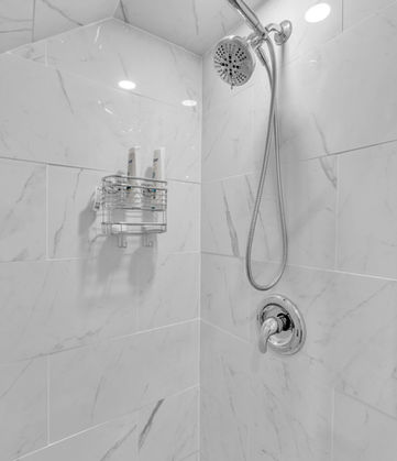 Modern renovated bathroom. Detailed shot of shower area.