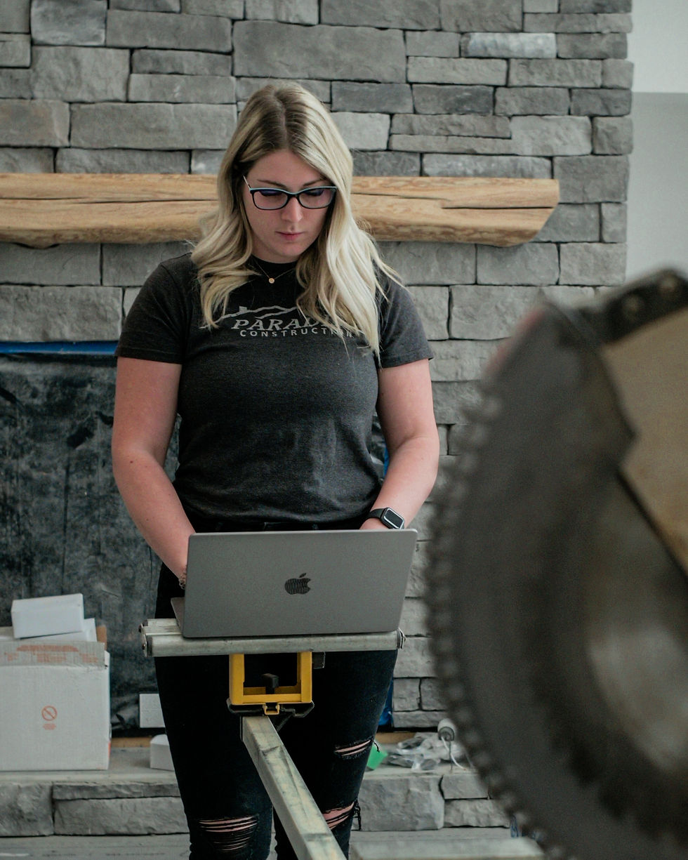 Labourer working on computer on site