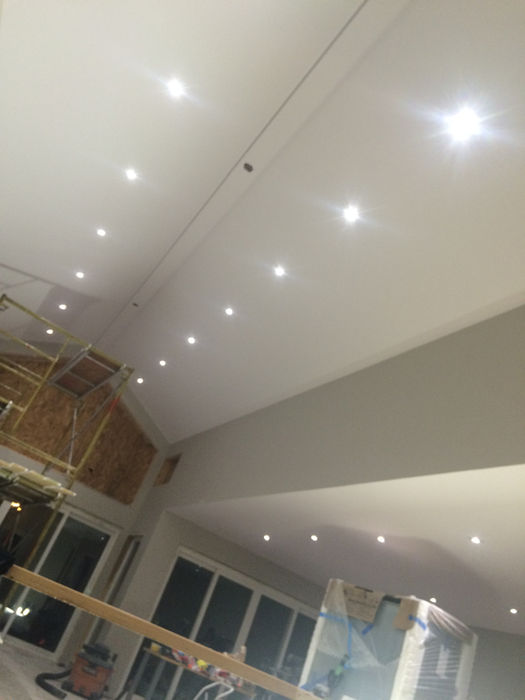 Home interior with white ceiling and recessed lights