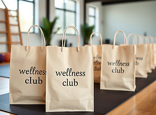 gift bags that say 'wellness club' in a
