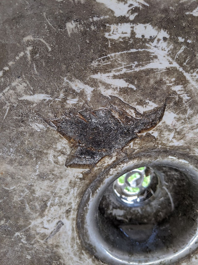 Rust and Damage to Porcelain on Antique Utility Sink