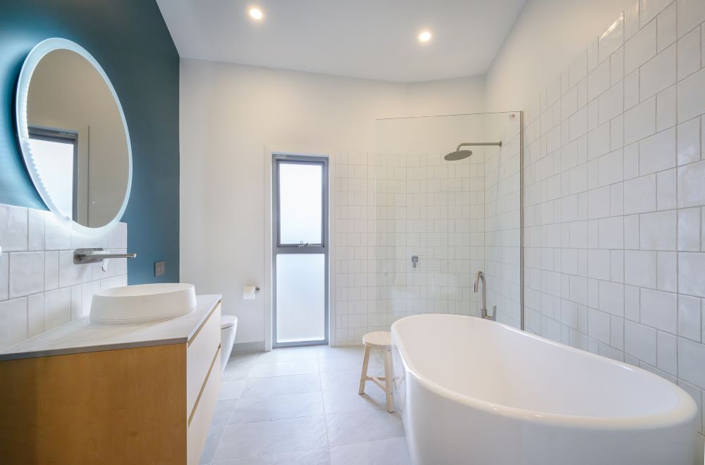 Bathrrom with bath, shower and hand basin in the round house built by Roberts Builders in Corangamite Shire. 
