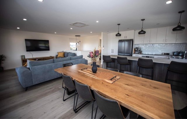 Dining, loungeroom and kitchen in a new home built by Roberts Builders in Peterborough, Victoria.