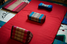 Thai massage mat with cushions at Olive Tree Therapies in Leith
