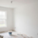 Painting contractor Jacksonville FL finishing a white room.