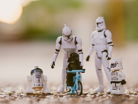 LEGO Star Wars figures with Darth Vader on a blue bike.