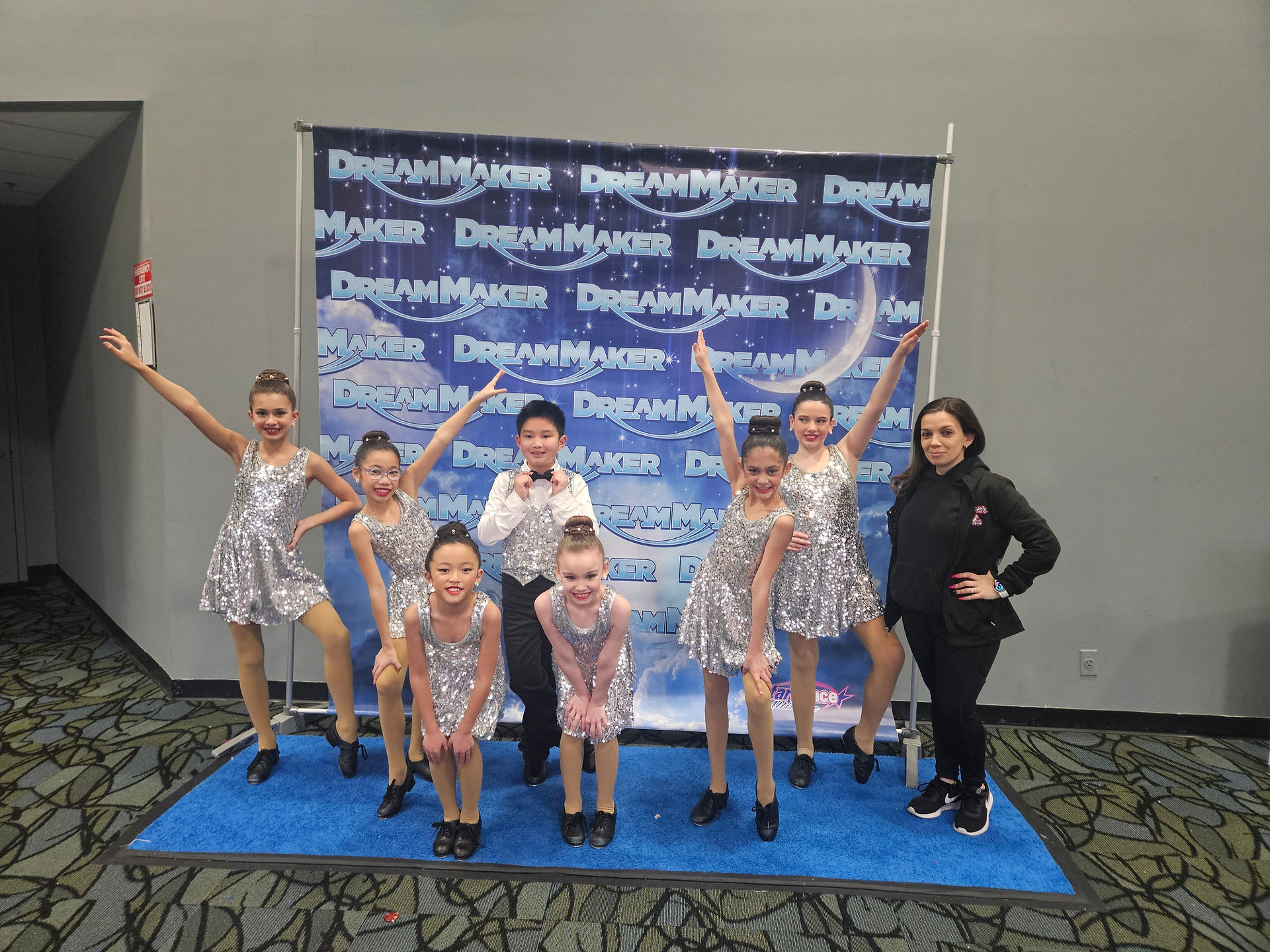 Dance group with Dream Maker backdrop. 5 Tips To Improve Technique as a Dancer