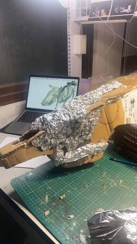 Cardboard and plastic bottle as base, adding aluminum foil.