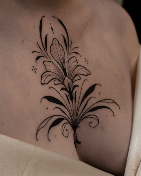 elegant ornamental chest tattoo 