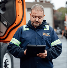 Driver completing a vehicle inspection report