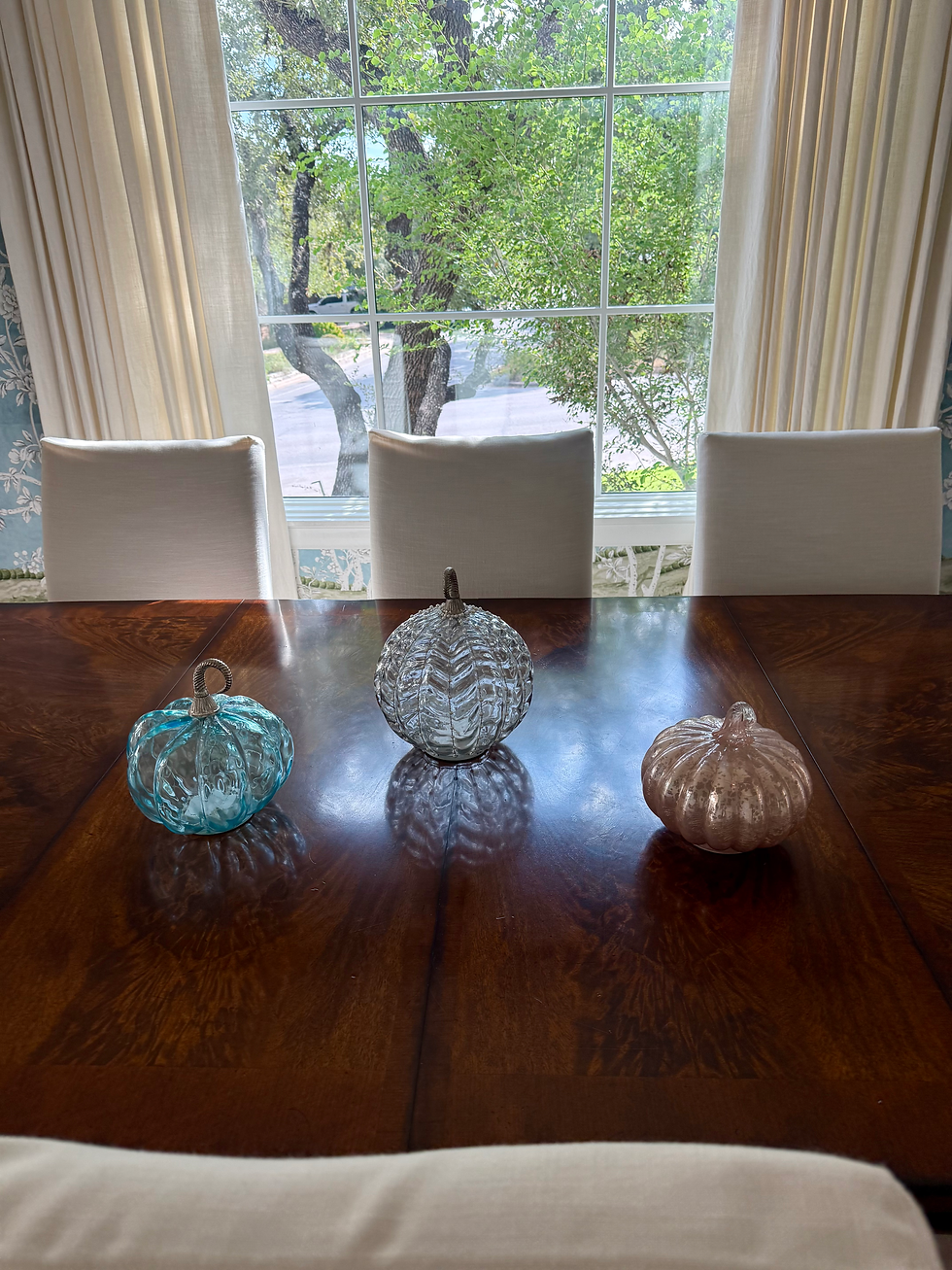 Sunlight illuminates my glass pumpkins in my Dining Room