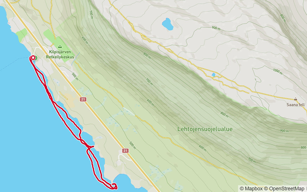 Map of Kilpisjärvi area showing hiking trails in red near a lake. Notable landmarks include Kilpisjärven Retkeilykeskus and Saana fell.