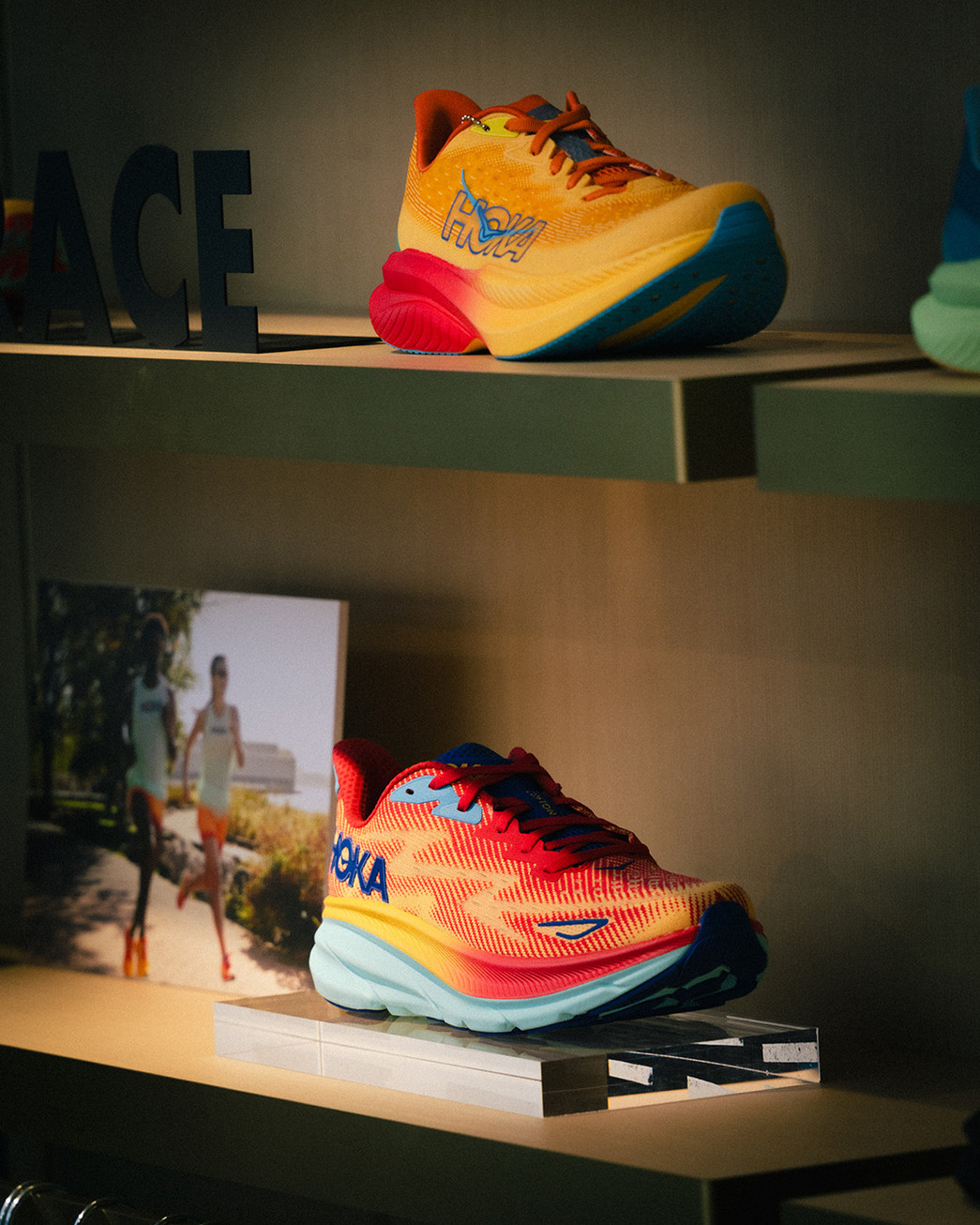 colorful JOKA running shoe in elevated hovering display in red, yellow and orange color