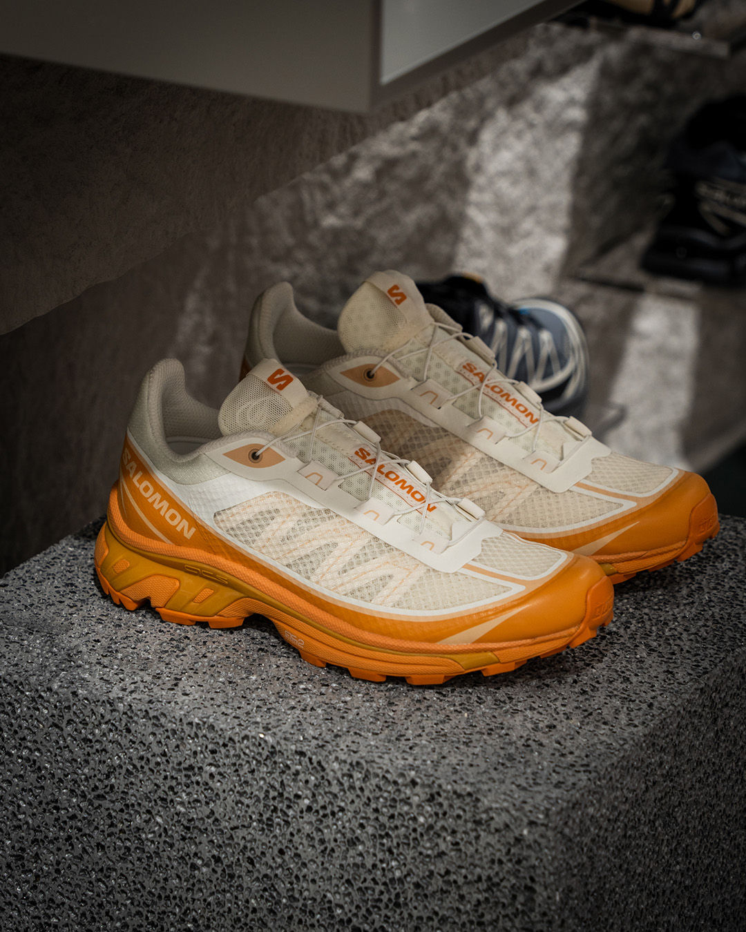 white/cream and orange salomon closed shoes, hiking wlking running trail shoe