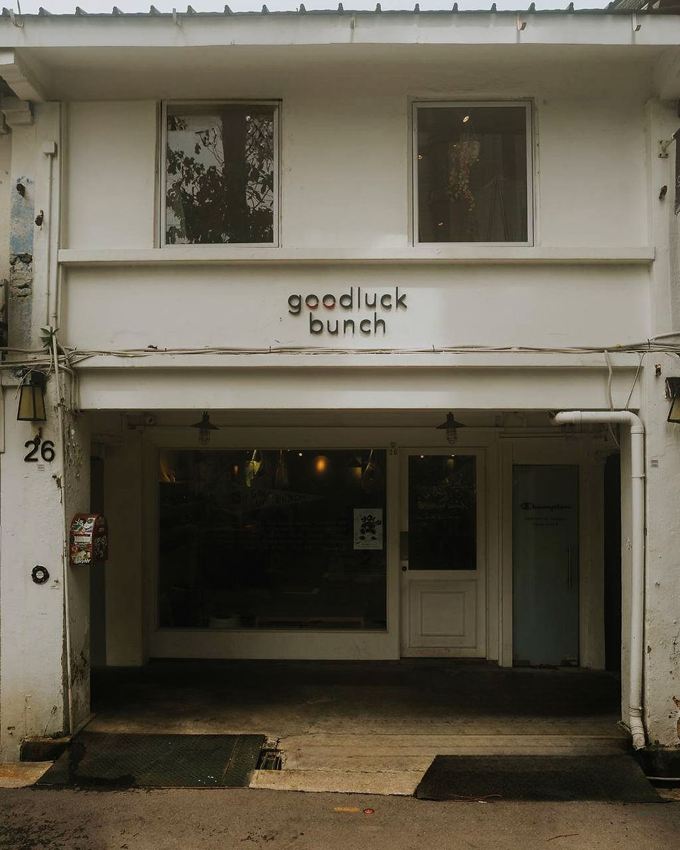 store front outside of goodluck bunch in singapore kampong gelam area white shop house