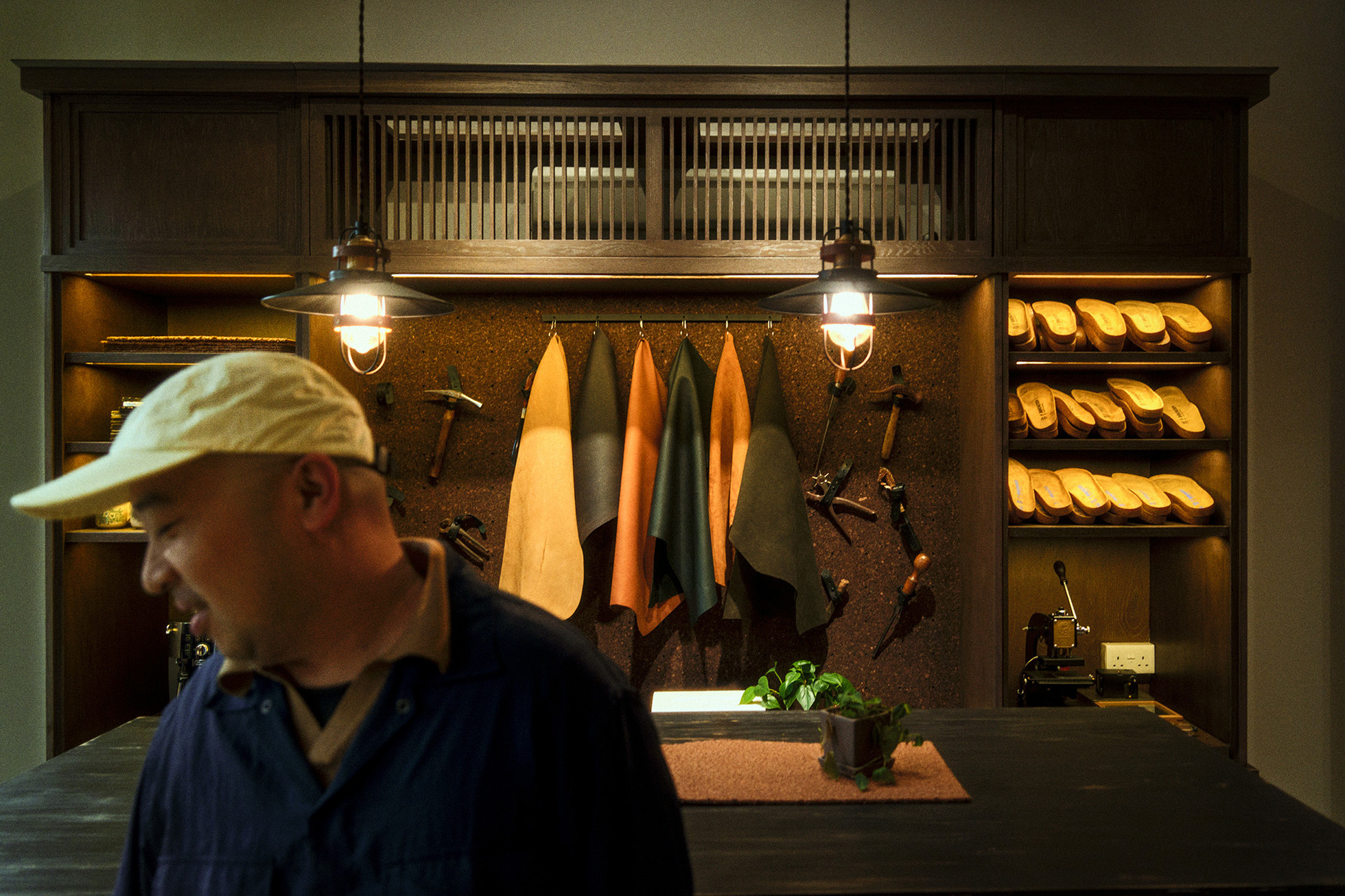 Chooee/man in frame with display shelf in background in house of birkenstock store duxton road singapore