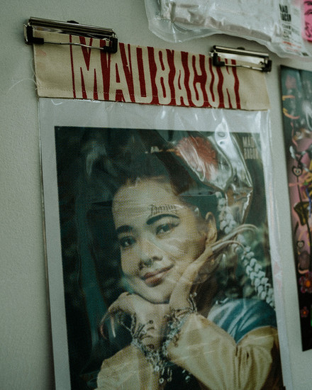 thai woman photograph and madbacon text logo