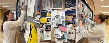 Hanging up flyers around town