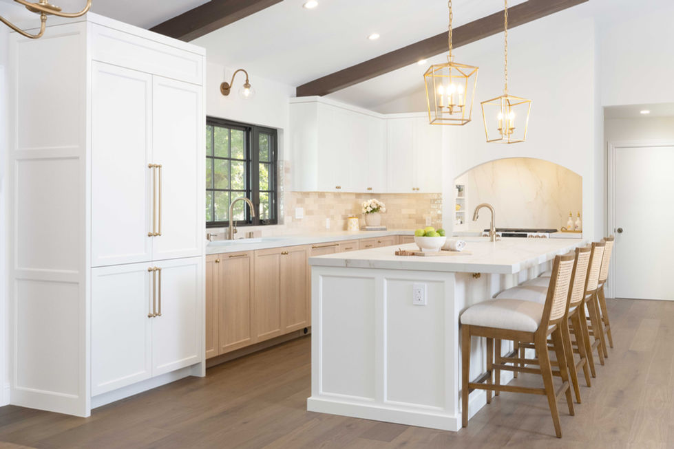 traditional kitchen remodel white cabinets rift cut white oak cabinets marble countertops large kitchen eat in kitchen vaulted ceiling brass lighting wood beams