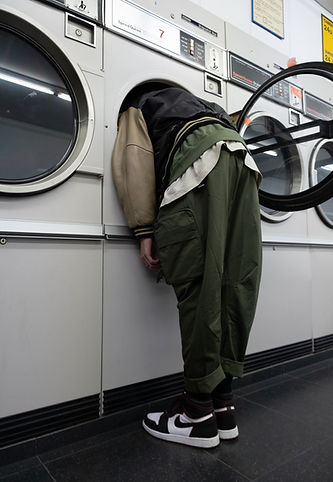 green jacket on white front load washing machine_edited.jpg