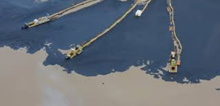 Recovered water being returned to the environment from tailings pond cleanup.