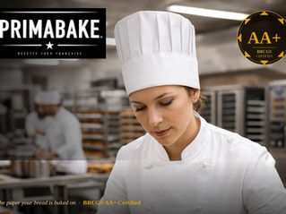 Chef holding a tray of pastries baked on Primabake® ® BRCGS AA+ certified food safe baking paper