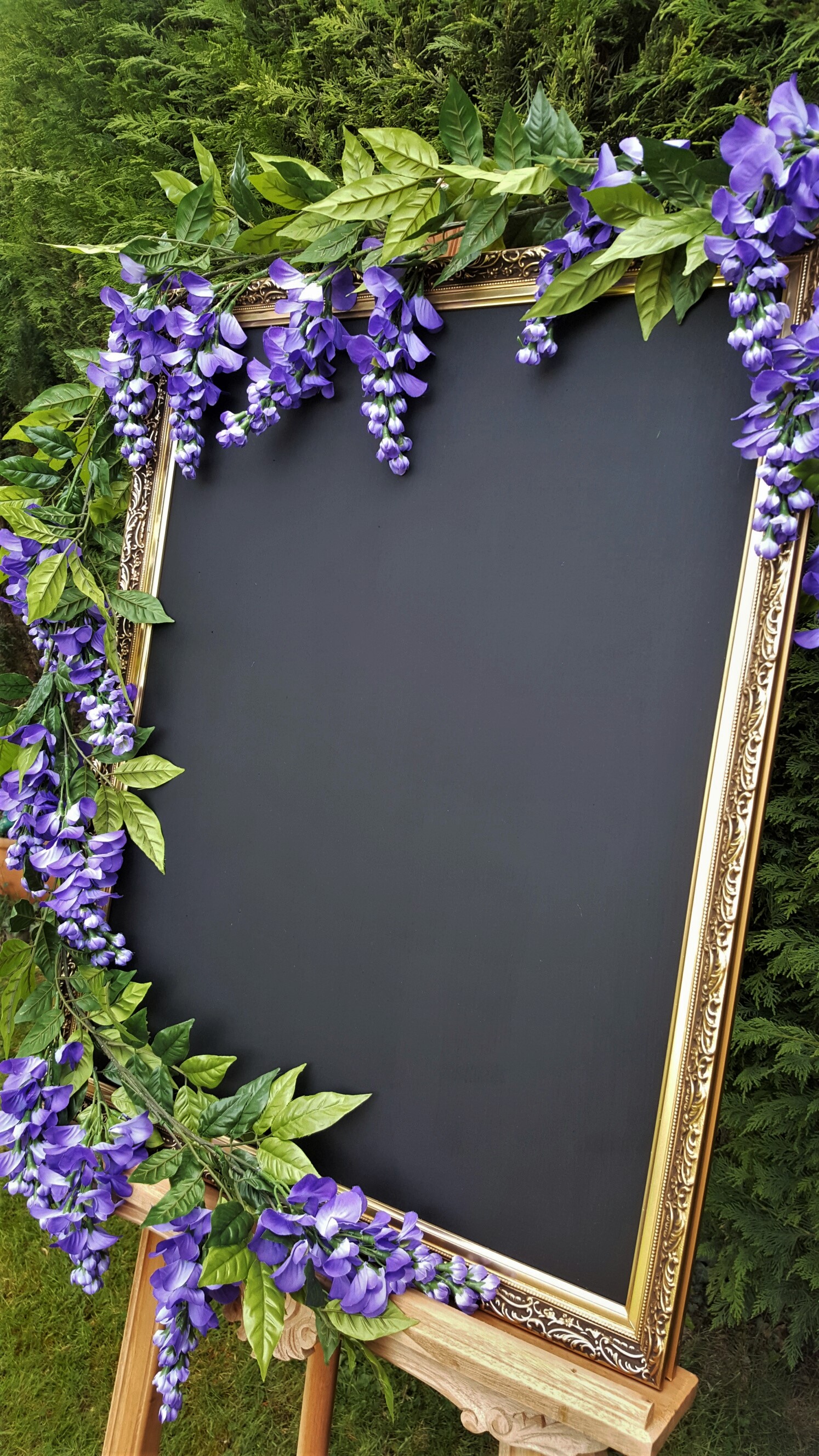 Large chalkboard with purple flora