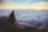 A business founder contemplating an inspiring view over the clouds