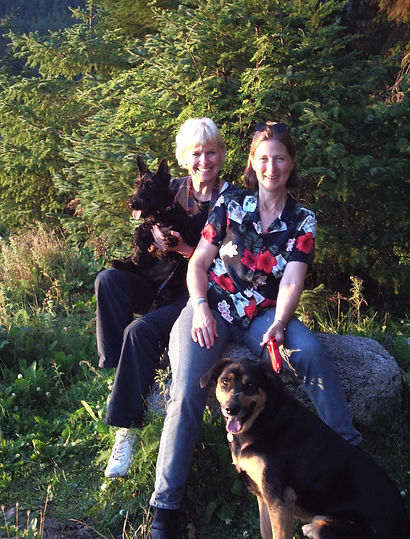 Susan and Kathy posing with dog in 2008