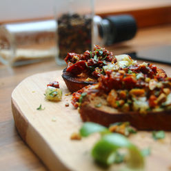 Bruschetta with Sun-Dried Tomatoes, Almonds, Citrus & Thyme
