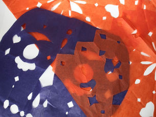 An image of picado banners, a traditional, colourful decoration for Day of the Dead celebrations.