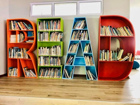 Colourful Bookshelf spelling the word READ