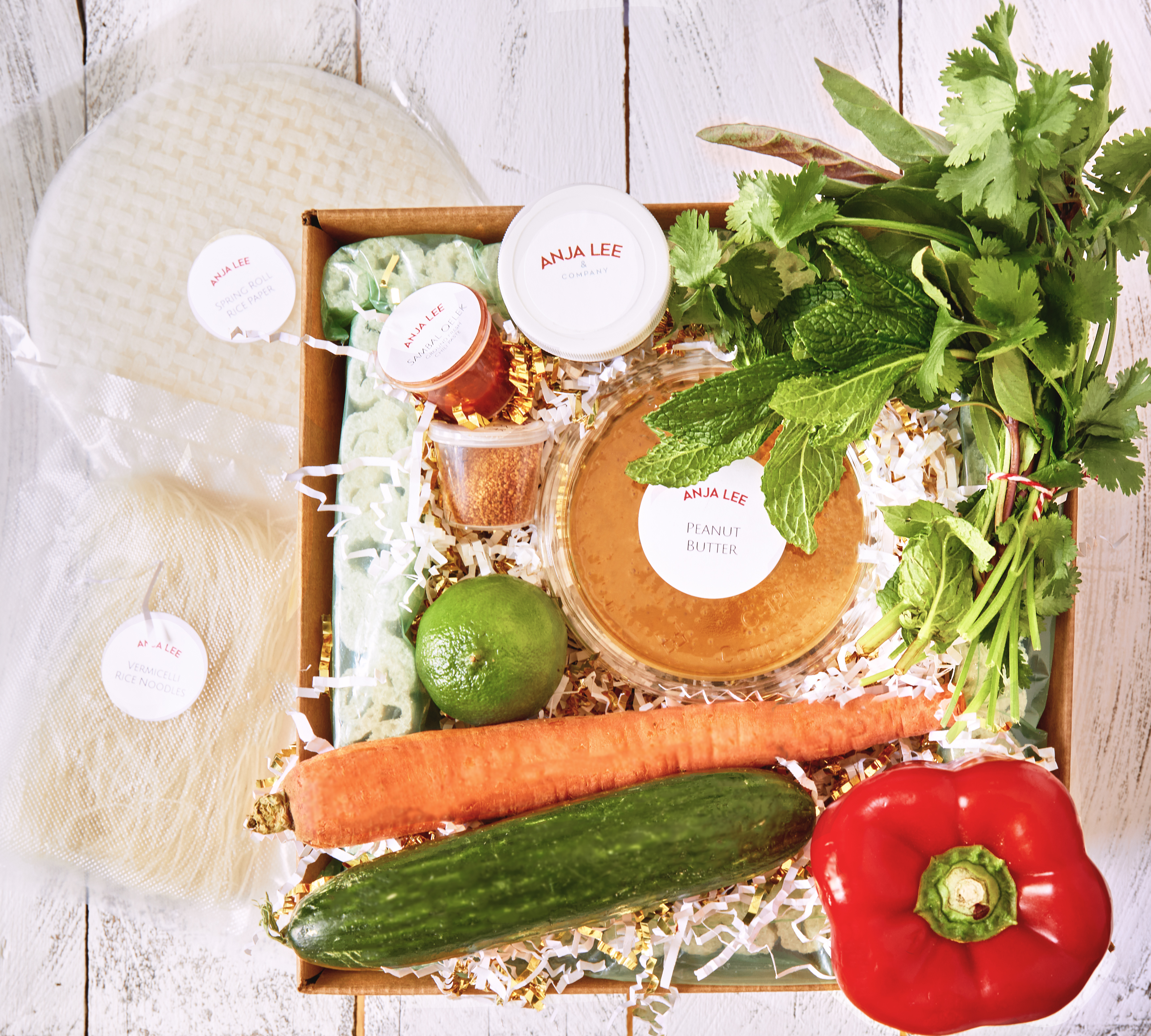 Spring roll kit with rice paper, herbs, carrot, cucumber and red pepper