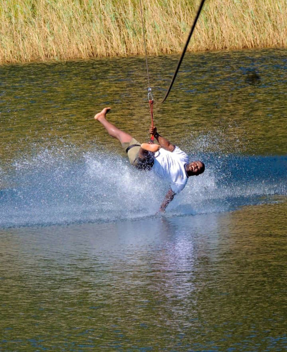 Man wakeboarding and crashing into the water