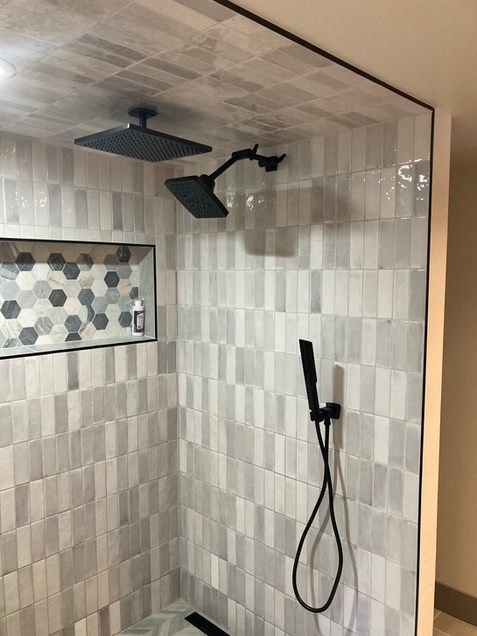Multiple rain shower heads were used for this new shower install. 