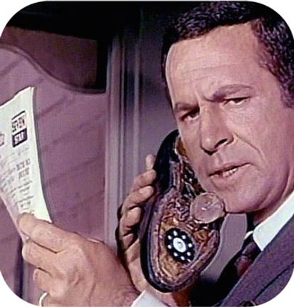 Retro TV character Max Smart talking on his shoe phone