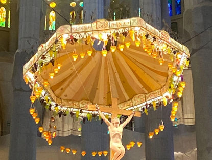 Crucfix Surrouned by Candles Suspended from the ceiling in La Sagrada Familia