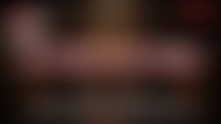 two men holding hands over an open grave in a creepy basement