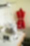 Picture of the Preloved Studio. Industrial overlocker & red tailors mannequin with tape measure draped around shoulders