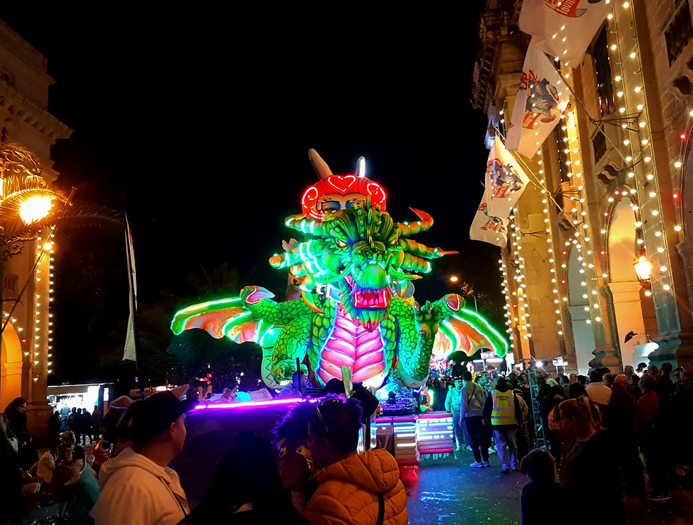 A Dragon flies down a street in Valetta, Malta for Carnival