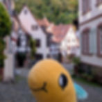 MiniWurm on Juedengasse in Weinheim, Germany. One of the two Weinheim castles is visible in the back.