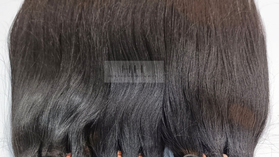 Close-up view of natural raw Indian hair extensions with a smooth texture
