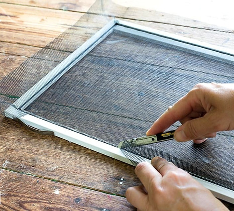 window screen being repaired