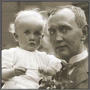 Vintage photograph of John Wayman holding a baby