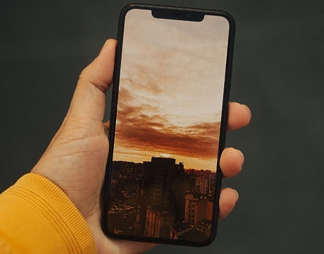 person holding black iphone 5_edited_edited_edited_edited.jpg